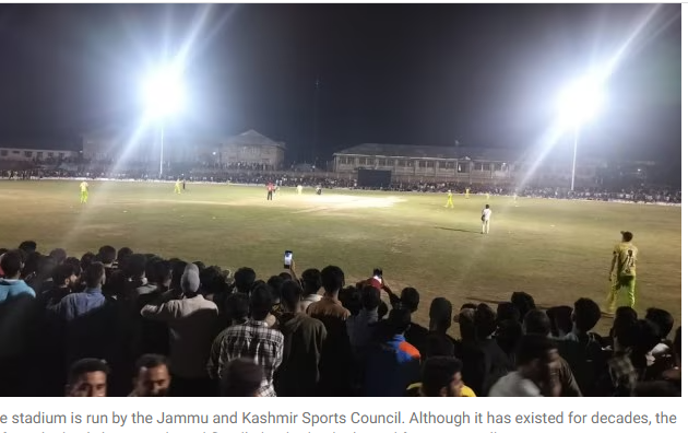 Alt Key: “Cricketers playing under floodlights on new turf in Pulwama Kashmir”